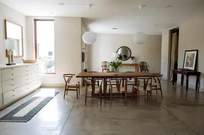 a dining room with a wooden table and chairs at Stylish Penthouse in West Hollywood in Los Angeles