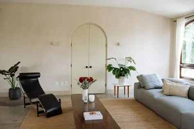 a living room with a couch and a table at Stylish Penthouse in West Hollywood in Los Angeles