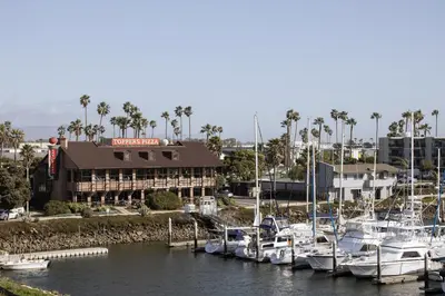 a group of boats docked in a marina at Waterfront 104 in Oxnard