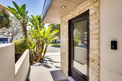 a door to a house with a plant at Shop, Dine and Walk to Ocean Redondo Beach Apt! in Redondo Beach