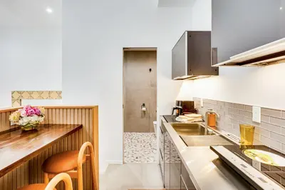a kitchen with a sink and a counter top at Shop, Dine and Walk to Ocean Redondo Beach Apt! in Redondo Beach