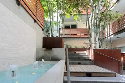 two swans swimming in a pool in a building at The Amber Serene Peaceful Retreat Pool Gym And Jacuzzi in Los Angeles