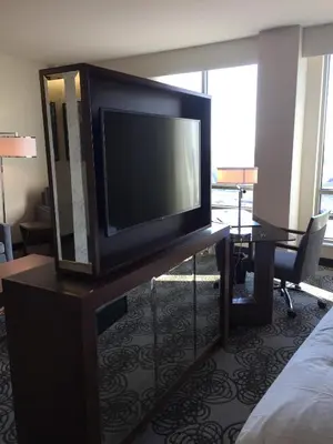 a flat screen tv sitting on a table in a hotel room at Parkwest Bicycle Casino in Bell Gardens