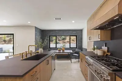 a kitchen with a sink and a stove at The Dona Modern in Los Angeles