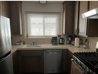 a kitchen with a sink and a stove top oven at Northridge 3BR 2BA Home with Pool on a Tree-Lined street, Close to CSUN in Northridge