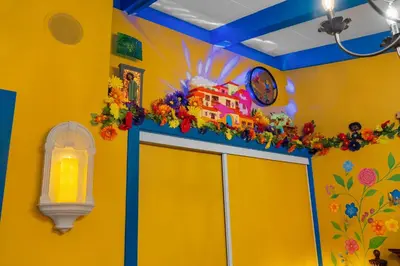 a yellow room with a building on top of a door at Enchanted Dreams by OC Adventure Homes in Garden Grove