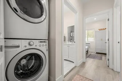 a washer and dryer in a room with a bathroom at Stay on Hart in Los Angeles