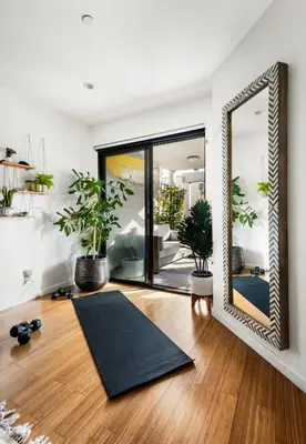 a living room with a mirror and a rug at Oceanfront Artists Retreat Santa Monica Luxury in Los Angeles