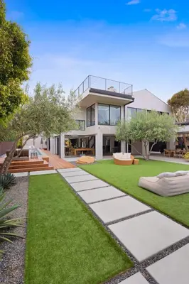 an image of a house with a garden at The Colony Reserve by Stay Awhile Villas in Malibu Beach