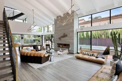 a living room with a couch and a fireplace at The Colony Reserve by Stay Awhile Villas in Malibu Beach