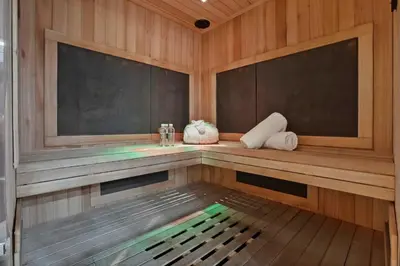 a sauna with wooden walls and a wooden floor at The Hideaway Beach House by Stay Awhile Villas in Malibu Beach