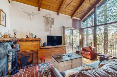 a living room with a couch and a tv at Couples Retreat Near Lake Arrowhead and Hiking! in Lake Arrowhead