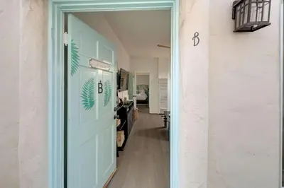 a door leading to a hallway with a room at At Hermosa Ave and Pier ave- B in Hermosa Beach