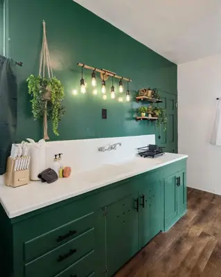 a bathroom with a sink and a green wall at At Hermosa Ave and Pier Ave- C in Hermosa Beach