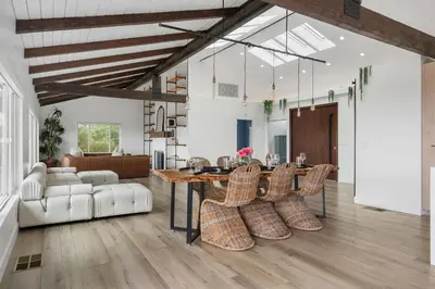 a living room with a dining room table and chairs at New Listing Palisades Villa by Colby & Conrad in Los Angeles