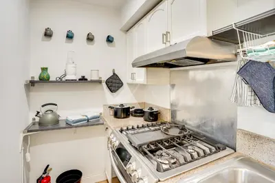 a kitchen with a stove top oven in a kitchen at Explore SoCal! Cozy Retreat Near Disney and Beaches in Westminster