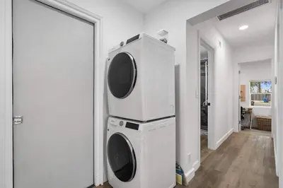 a washer and dryer in a room with a mirror at New Listing City Bungalow by Colby & Conrad in Los Angeles