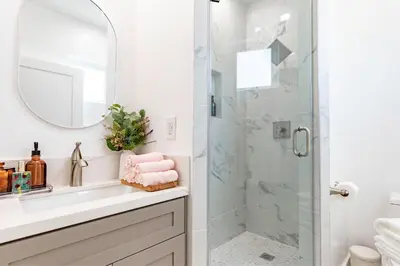 a bathroom with a shower and a sink at Luxury House 3-Level 4-bedroom, Free Parking and Patio in Los Angeles