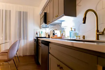 a kitchen with a sink and a counter top at Luxury House 3-Level 4-bedroom, Free Parking and Patio in Los Angeles