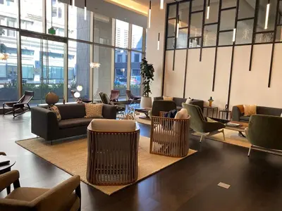 a lobby with couches and chairs in a building at Luxury 1 Bedroom vacation Home in Downtown LA in Los Angeles