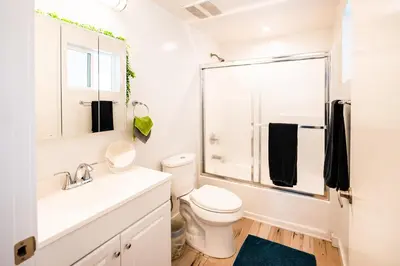a bathroom with a toilet and a sink and a shower at Modern 1-Bedromm Loft In Hollywood With Viwe of Hollywood Sign in Los Angeles