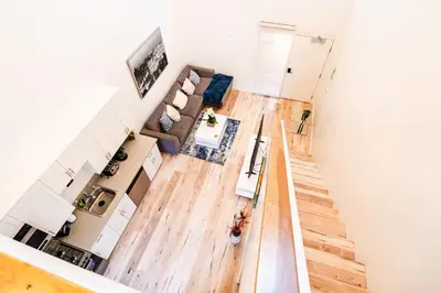 an overhead view of a living room and dining room at Modern 1-Bedromm Loft In Hollywood With Viwe of Hollywood Sign in Los Angeles