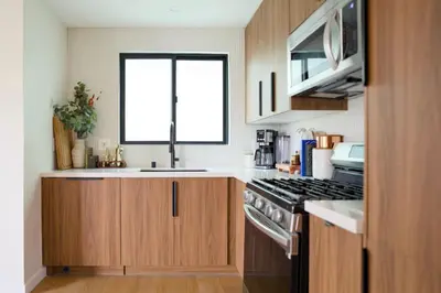 a kitchen with a stove and a window in it at New Venice Beach Zen Hideaway in Los Angeles