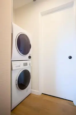 a microwave sitting on top of a oven in a room at New Venice Beach Zen Hideaway in Los Angeles