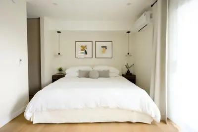 a white bedroom with a large white bed at New Venice Beach Zen Hideaway in Los Angeles