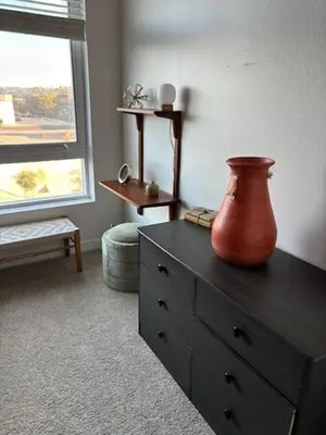 a vase on a dresser in a room with a window at 242 Charming, Peaceful Apartment Retreat in Griffith in Glendale