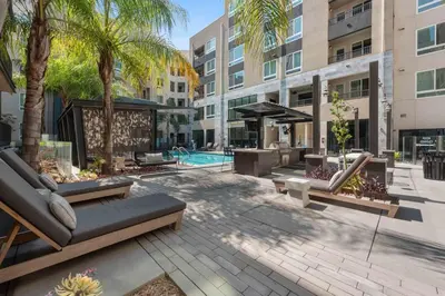 a courtyard with benches and a pool in a building at 242 Charming, Peaceful Apartment Retreat in Griffith in Glendale