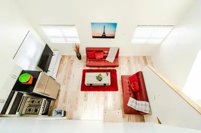 an overhead view of a living room with red furniture at Chic Hollywood Koreatown 3Bedroom Loft 3 Level 2 Bathrooms Perfect for Groups up to 10 in Los Angeles