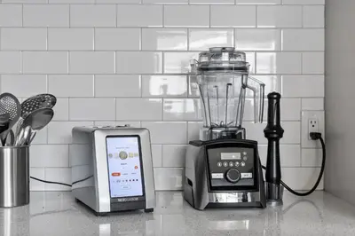 a blender sitting on a counter next to a phone at KingBeds Skylight 1GB Wi-Fi Step-free Clean in Bakersfield