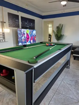 a billiard table in a living room with at Entire Front House in Los Angeles in Los Angeles
