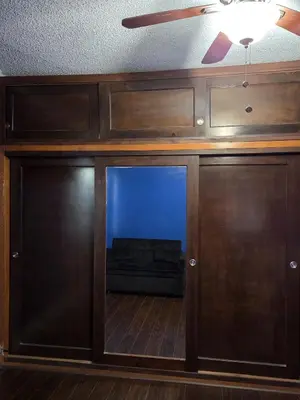 a sliding glass door with a couch in a room at Entire Front House in Los Angeles in Los Angeles