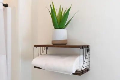 a plant sitting on a shelf with a towel at Modern 1BR Suite w AC Sleeps 3, NW Bakersfield in Bakersfield