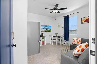 a living room with a couch and a ceiling fan at Modern 1BR Suite w AC Sleeps 3, NW Bakersfield in Bakersfield