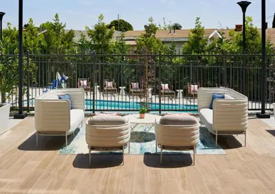 a patio with chairs and a table and a pool at LAX 1 Bed Luxe with FREE PARKING in Los Angeles