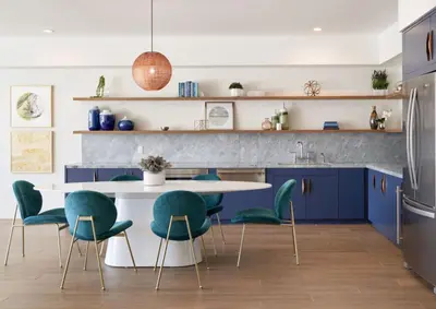 a kitchen with blue cabinets and a white table and chairs at LAX 1 Bed Luxe with FREE PARKING in Los Angeles
