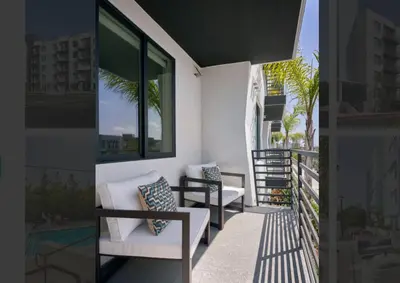 a balcony with two chairs and a window at LAX 1 Bed Luxe with FREE PARKING in Los Angeles