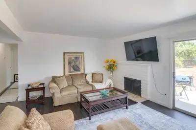 a living room with a couch and a fireplace at HOV Lux Whitehouse Lakeview Terrace