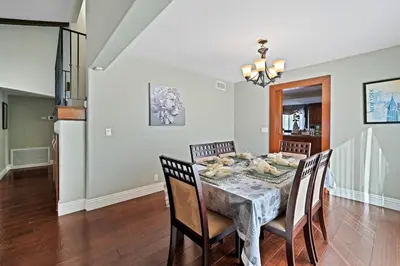 a dining room with a table and chairs at Gorgeous Villa with Private Heated Pool in Garnsey