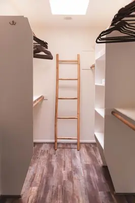 a room with a ladder in a closet at Mid-Century Modern Hillside Escape With Dome and Views in Los Angeles
