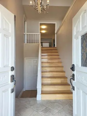 a staircase in a home with a chandelier at Spacious and Exclusive Oasis 6BR 3BA in Thousand Oaks