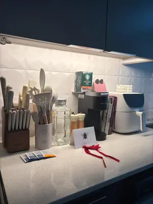 a kitchen counter with utensils on a counter top at Aqua Marina Oceanfront Escape in Long Beach