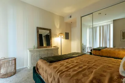 a hotel room with two beds and a mirror at Marvelous 2BR 2BA Apartment in Los Angeles