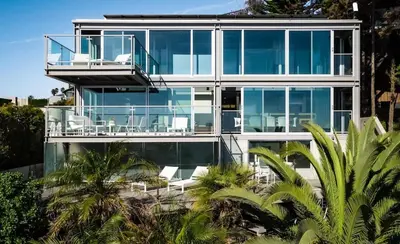 a house with a lot of glass at Broad Beach Wdirect Beach Access in Malibu