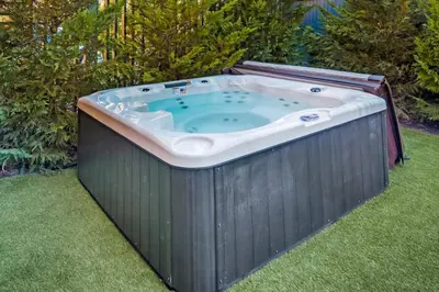 a jacuzzi tub sitting in the grass at Broad Beach Wdirect Beach Access in Malibu