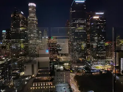 a view of a city skyline at night at Luxury Vacation Resort Studio Downtown LA in Los Angeles