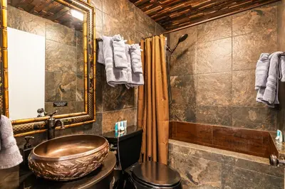 a bathroom with a copper sink and a shower at Spacious 2 Bedroom Condo in DTLA, Large Private Patio, Pets Welcomed in Los Angeles